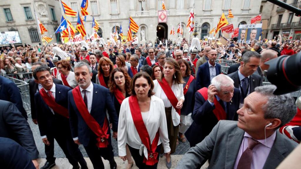 Barcelona’s new mayor Ada Colau (centre) walks next to Jaume Collboni, Ernest Maragall and Manuel Valls after her swearing-in ceremony, at Sant Jaume square on June 15th. Photgraph: Albert Gea/Reuters