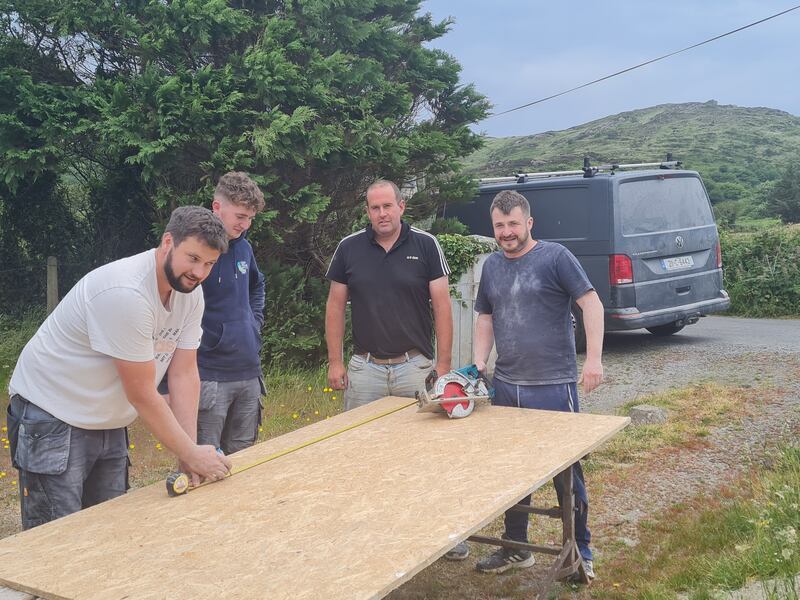 Chris O Driscoll, David Sheehan, Pat Sheehan and Jason Harrington of Urhan Construction working on a house renovation on Bere Island