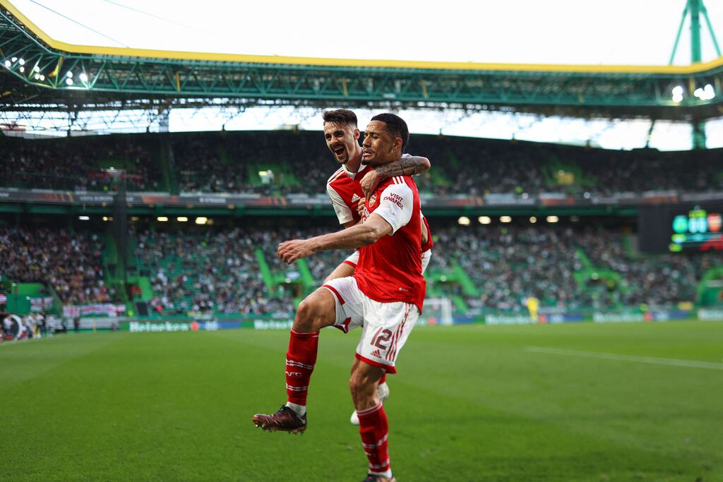 Arsenal's William Saliba celebrates with Fabio Vieira after scoring his team's first goal during the Europa League last 16, first leg match at Estádio José Alvalade in Lisbon. Photograph: Filipe Amorim/AFP via Getty Images