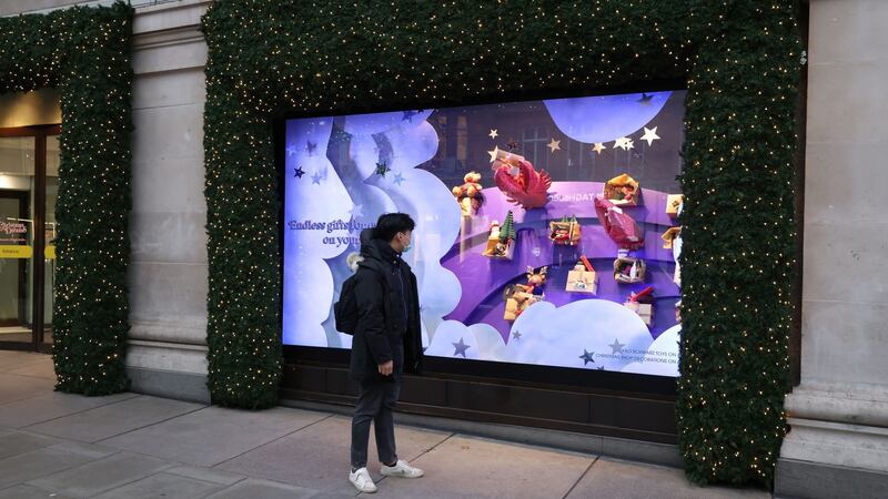 A shopper looks at a window display at Selfridges on Oxford Street, London. Photograph: James Manning/PA Wire