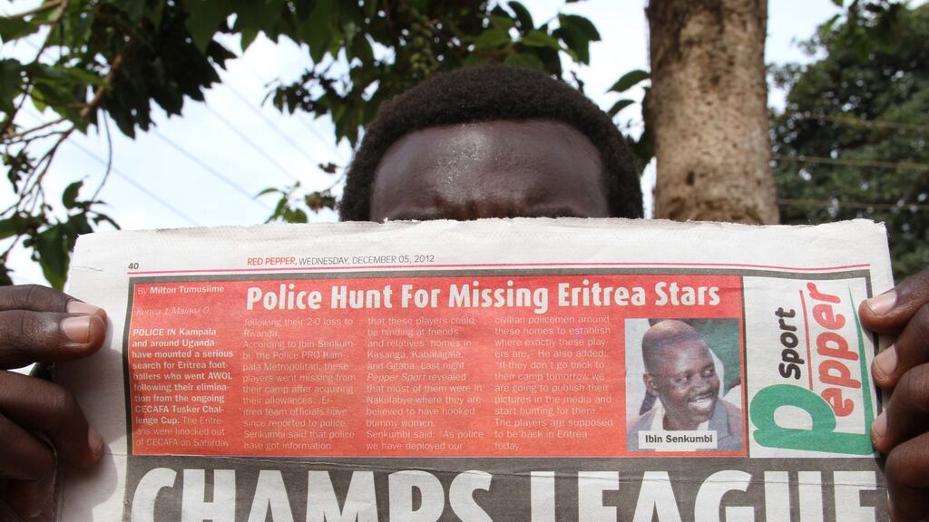 Recurring issue: a newspaper in Kampala carries a report on Eritrean footballers who disappeared from a hotel they were staying in the Council for East and Central Africa Football Associations in 2012. Photograph: Isaac Kasamani/AFP/Getty