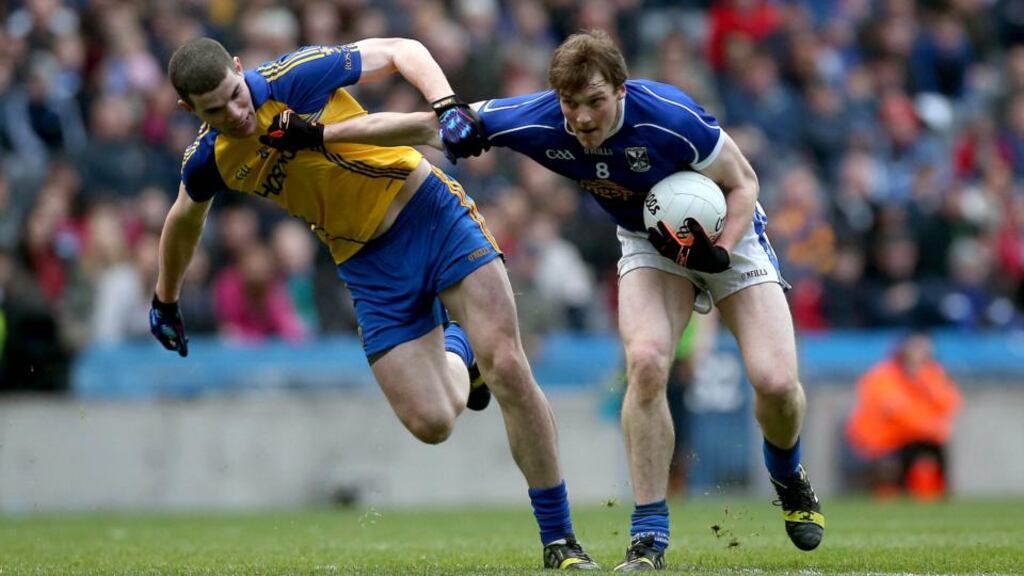 Cavan’s Gearóid McKiernan and Cathal Shine of Roscommon battle it out at Croke Park in the NFL Division Three final. Photograph: Ryan Byrne / Inpho