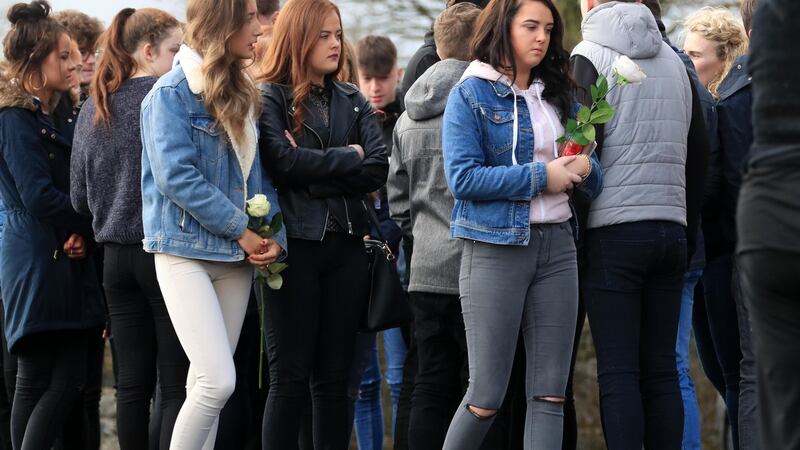 Friends of  Elisha Gault carry flowers at the Church of the Assumption, Piltown  at her funeral Mass. Photograph: Colin Keegan/Collins Dublin