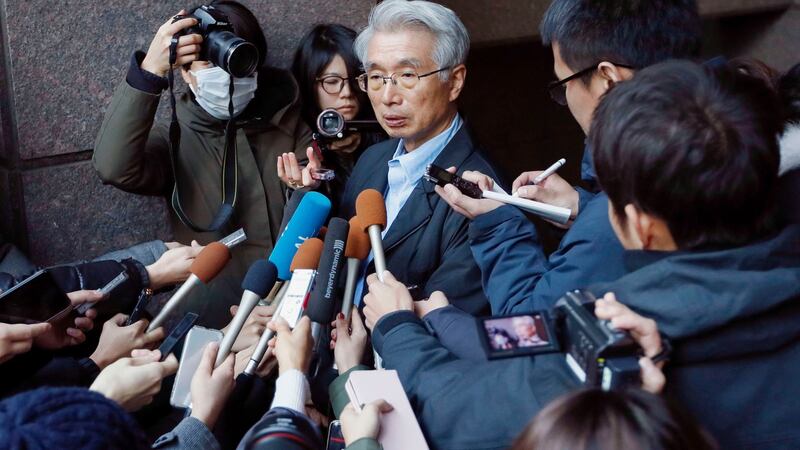 Junichiro Hironaka (center) lawyer for Nissan’s former chairman Carlos Ghosn, speaks to the media in Tokyo on Tuesday. Photograph: AP