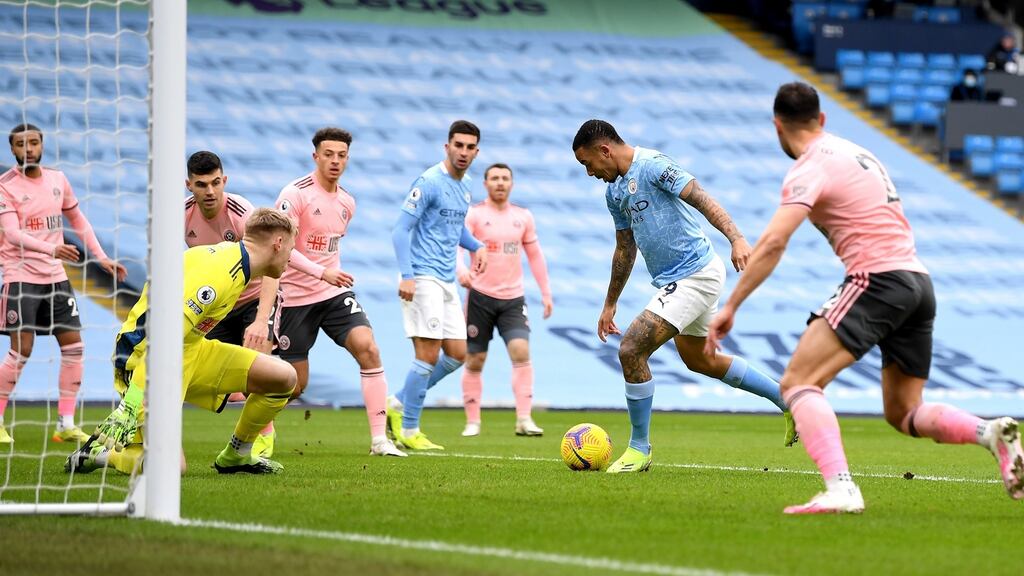 Gabriel Jesus of Manchester City scores during their Premier League clash with Sheffield United. Photo: Michael Regan/EPA