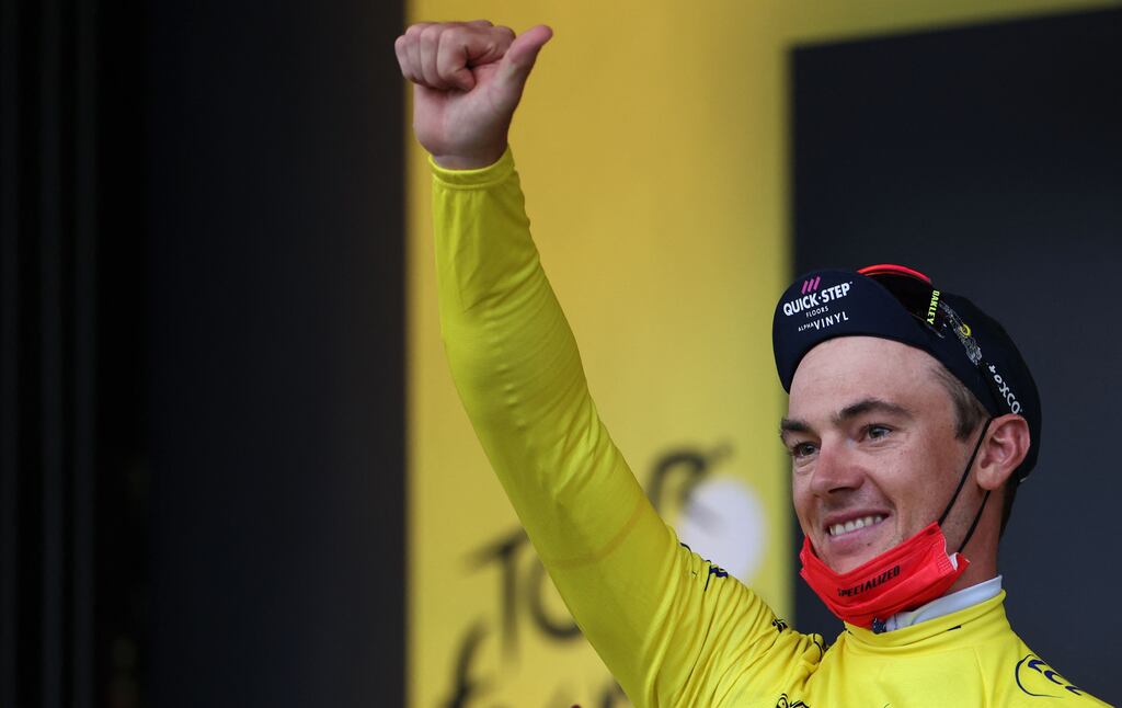 Yves Lampaert in the overall leader's yellow jersey on the podium after the first stage of the 2022 Tour de France. Photograph: Getty Images