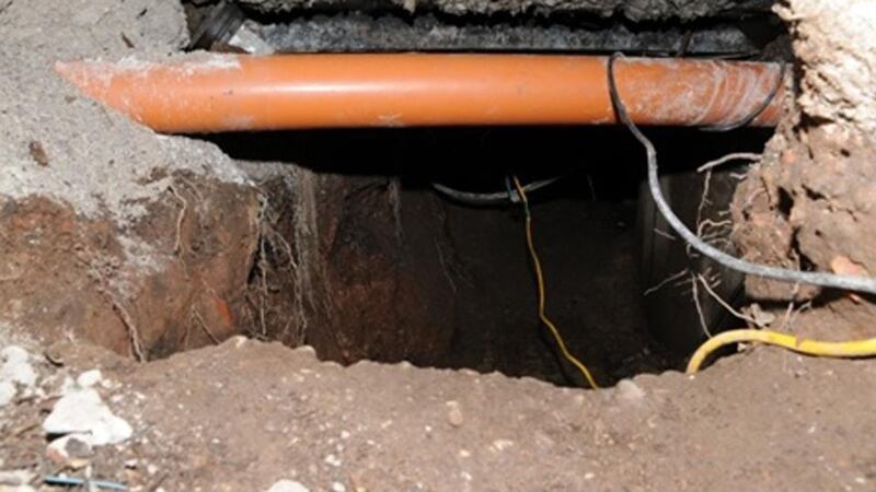 The entry to the tunnel dug by thieves under a Tesco outlet in England. Photograph: PA