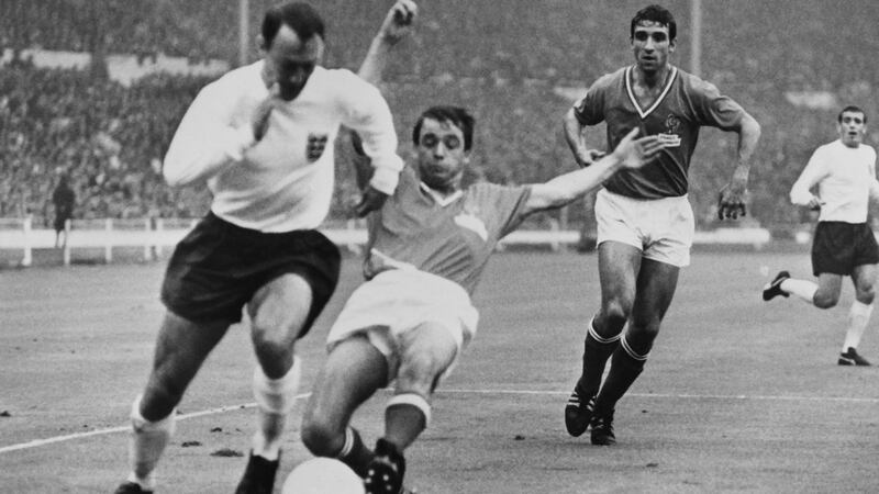Greaves goes past Jacky Simon of France during their 1966 World Cup clash. Photo: Stringer/AFP via Getty Images