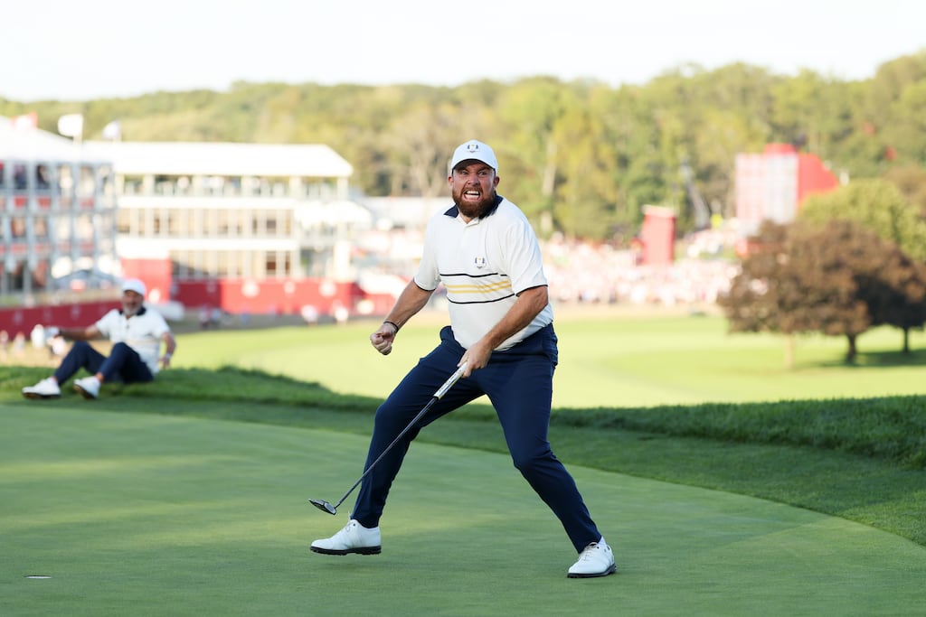 Shane Lowry celebrates after making his putt on the 18th to halve the hole for Europe to retain the Ryder Cup. Photograph: Richard Heathcote/Getty Images