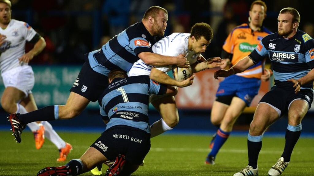 Leinster’s Zane Kirchner is tackled by Scott Andrews and Sam Hobbs of Cardiff Blues. Photograph: Huw Evans/Inpho