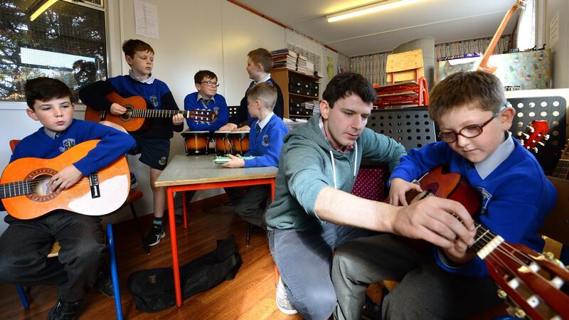 Students at St Cronans BNS, Bray, Co Wicklow, taking part in a Music Generation class. From left are     Ultan Moran, Ronan Hogan, Luke Shiel, Christopher Jensen, Alex Coogan, tutor Tim Doyle and Vincent Ducorroy. Photograph: Dara Mac Dónaill/The Irish Times