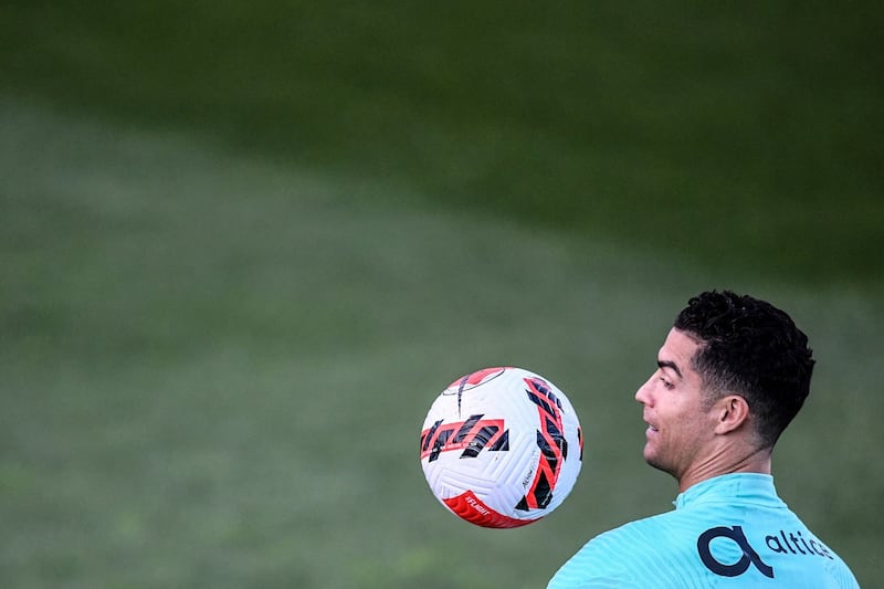 Portugal’s Cristiano Ronaldo eyes the ball during a training session at the Cidade do Futebol training camp in Oeiras, outside Lisbon. Photograph: Patricia de Melo Moreira/AFP via Getty Images