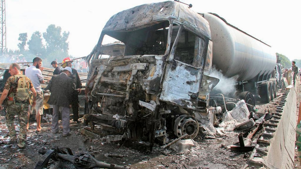 Syrian army soldiers inspect the damage at the site of two explosions that hit the Arzouna bridge area at the entrance to Tartous, Syria. Photograph: Sana/Handout via Reuters