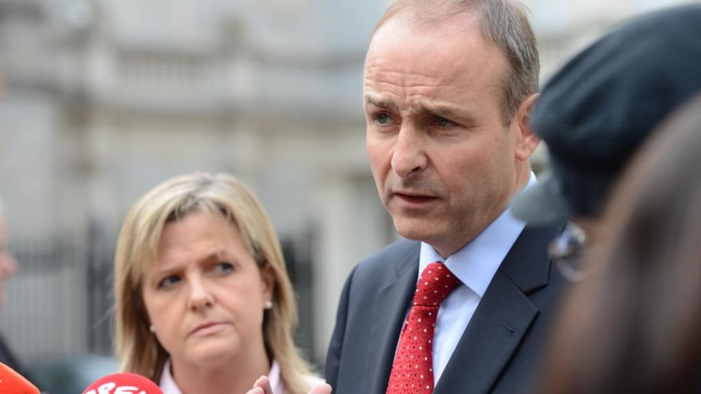 Councillor Deirdre Heney and Fianna Fáil leader Micheal Martin speaking to media on the plinth at Leinster House in 2012. Photograph: Alan Betson