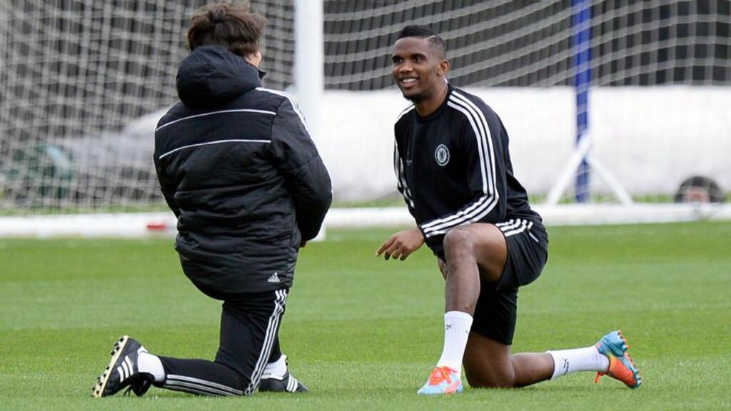 Chelsea’s Samuel Eto’o (right) warms up during a team training session at their in Cobham, Surrey. Photograph: Facundo Arrizabalaga / EPA