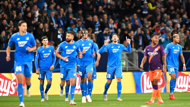Hoffenheim celebrate Ishak Belfodil’s early opener against Manchester City. Photograph: Thomas Kienzle/AFP/Getty