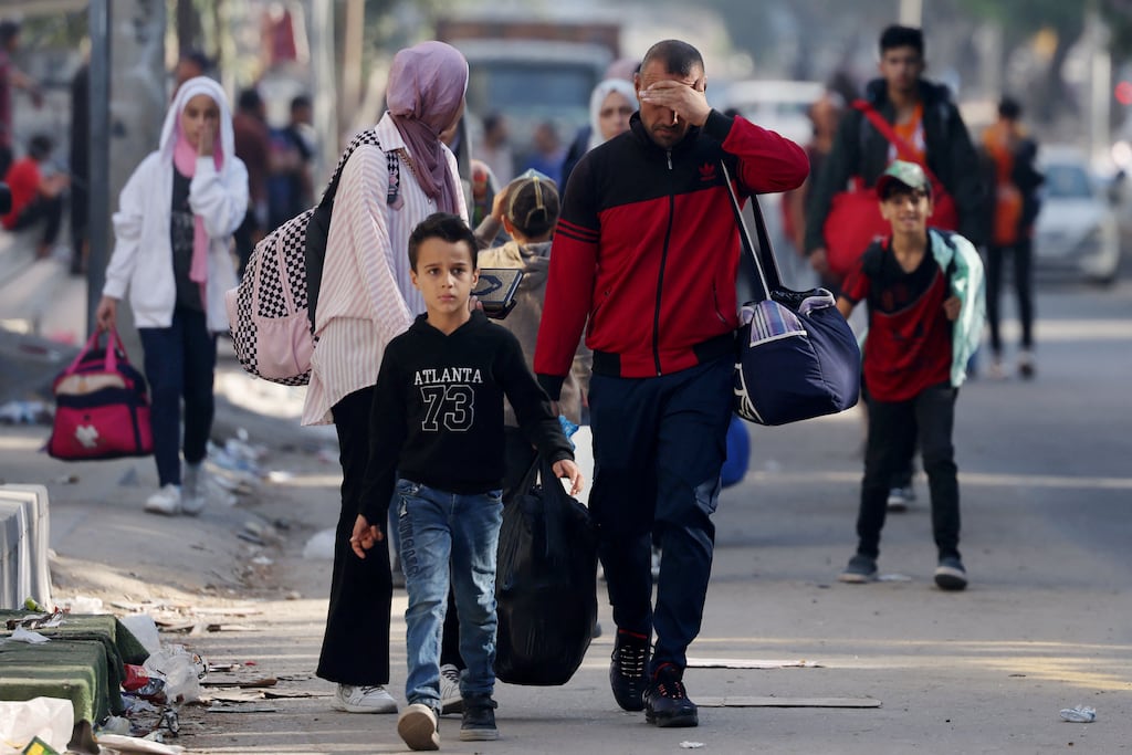 Palestinians flee to safer areas in Gaza City after Israeli air strikes. Photograph: Mohammed Abed/AFP via Getty Images