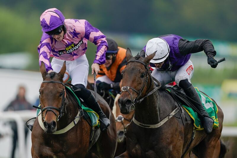 Danny Mullins riding Minella Cocooner (purple/black, white cap) to win the Bet365 Gold Cup at Sandown in April. Photograph: Alan Crowhurst/Getty Images
