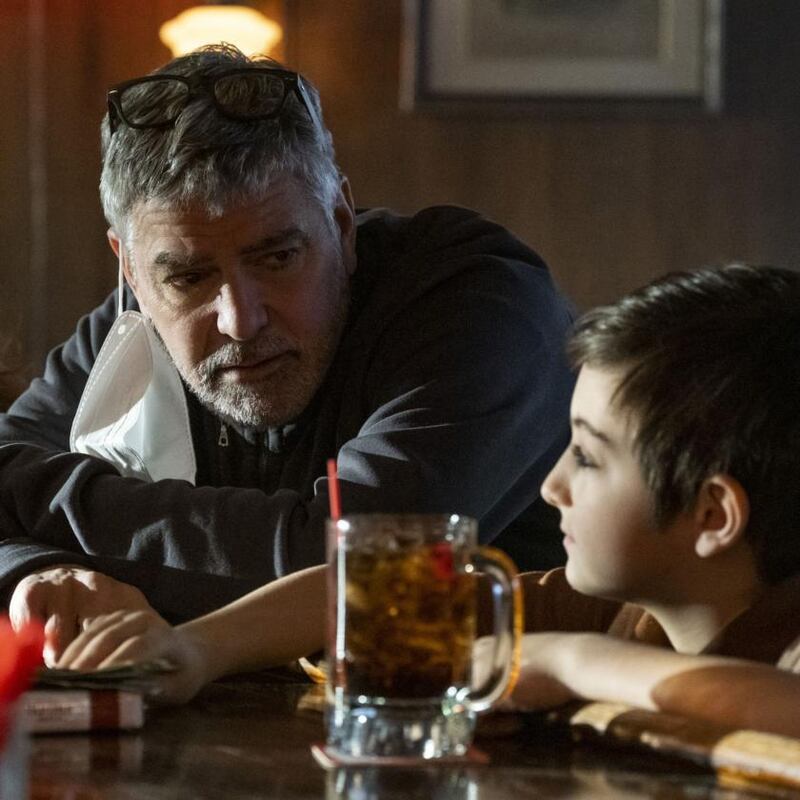 George Clooney with Daniel Ranieri on the set of Clooney’s film The Tender Bar: ‘I’ve been angry, and this was such a kind story.’ Photograph: Claire Folger/Amazon Content Services