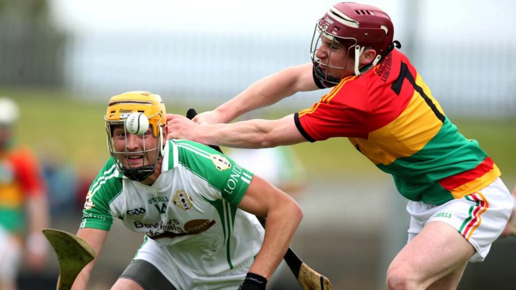 Martin Duggan of London evades James O’Hara of Carlow at Dr Cullen Park. Photograph: Donall Farmer/Inpho