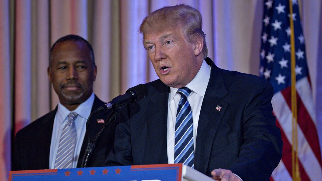 Donald Trump speaks during a news conference with Ben Carson on Friday: the retired neurosurgeon has endorsed Mr Trump after ending his own campaign last week. Photograph: Andrew Harrer/Bloomberg