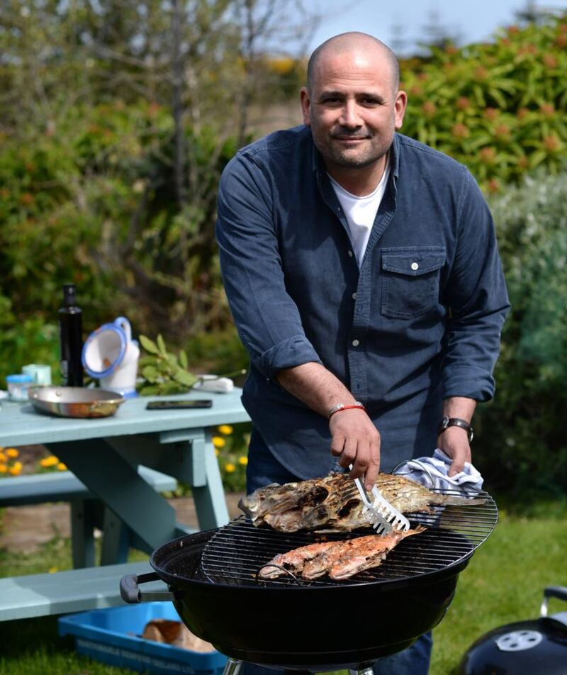 Niall Sabongi barbecuing fish in Howth, Co Dublin. Photograph: Dara Mac Dónaill/The Irish Times