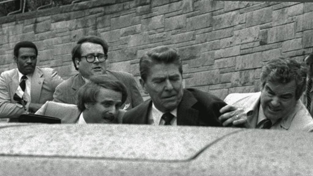 Then US president Ronald Reagan (dark blazer) is shot and wounded in an assassination attempt by John Hinckley jnr after leaving the Washington Hilton Hotel on March 30th, 1981. File photograph: Ron Edmonds/AP