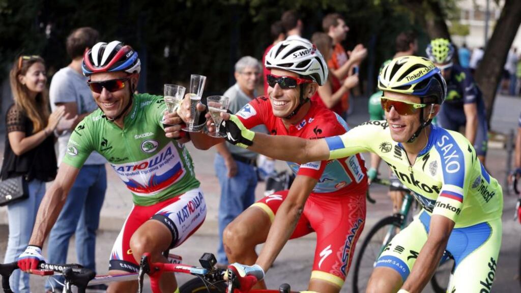 Italian cyclist Fabio Aru (C) of Astana, makes a toast with Spanish rider Joaquim Rodriguez (left) of Katusha and Polish rider Rafal Majka of Tinkoff-Saxo at the start of the 21st and last stage of the Vuelta a Espana, won by Aru. Photograph: Javier Lizon/EPA