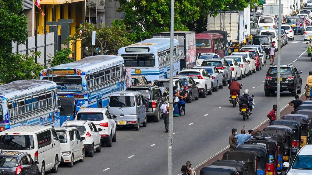 Motorists queue along a street to buy fuel at Ceylon petroleum corporation fuel station in Colombo, Sri Lanka. Photograph: Ishara S Kodikara/AFP via Getty Images