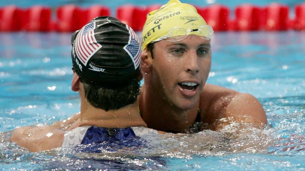 Silver medal winner Grant Hackett of Australia hugs gold medal winner Michael Phelps after the 200 metre Freestyle final during the XI FINA World Championships in 2005 in Montreal, Canada. Photograph: Jonathan Ferrey/Getty Images