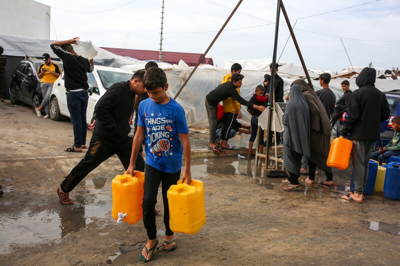 Water jugs are filled at an Unrwa camp for displaced Palestinians in Khan Younis, in the Gaza Strip, in November. Photograph: Samar Abu Elouf/New York Times