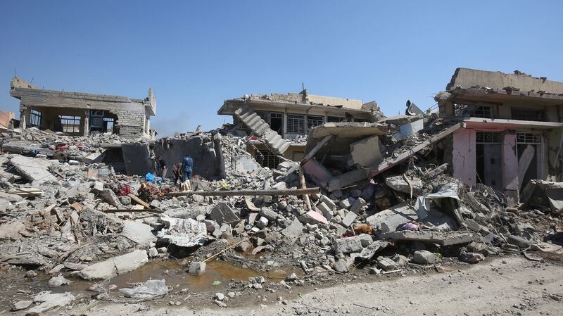 Iraqis inspect the damage following air strikes in Mosul. Photograph: Ahmad al-Rubaye/AFP/Getty Images