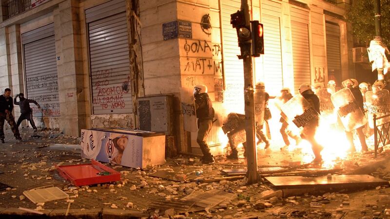 Demonstrators throw fire bombs at riot police during violent protests in central Athens in 2012. Photograph: Milos Bicanski/Getty Images