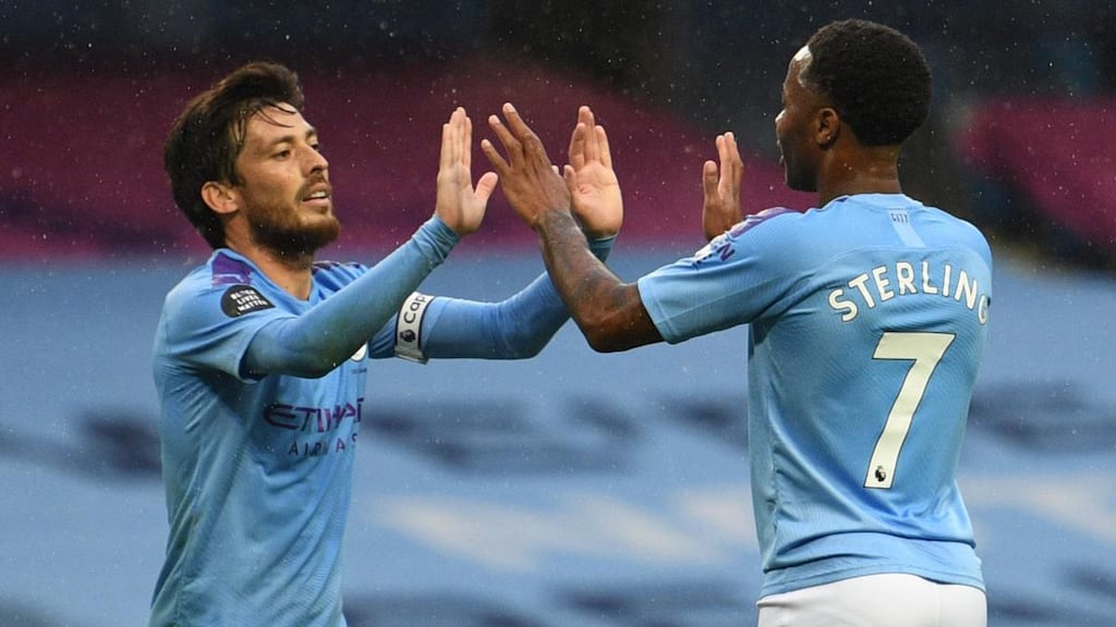 Raheem Sterling celebrates scoring Manchester City’s fifth with David Silva. Photograph: Oli Scarff/Getty/AFP