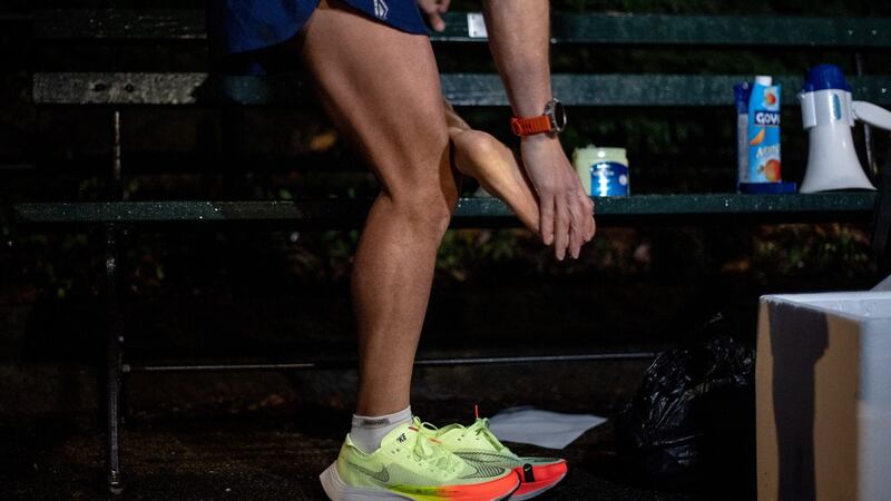 Oz Pearlman applies petroleum jelly to his feet before attempting to break the Central Park loops record. Photograph: Hilary Swift/The New York Times
