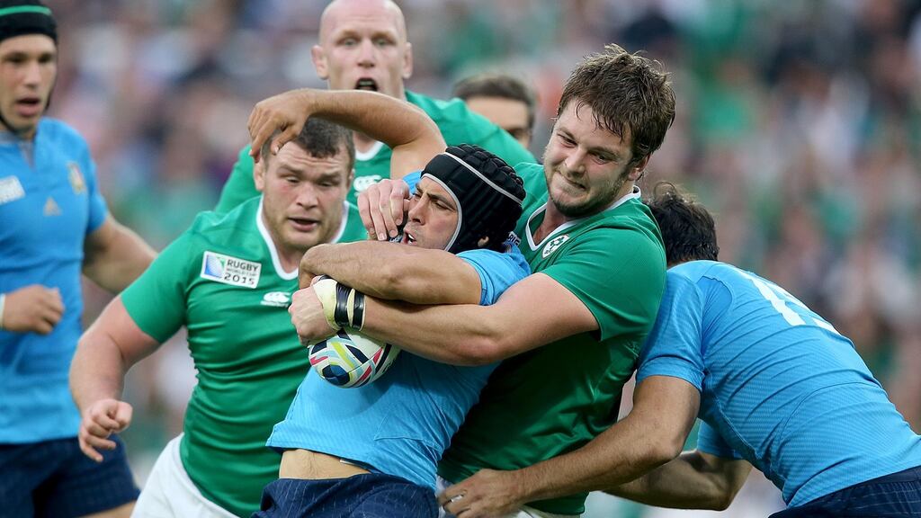 Ireland’s Iain Henderson tackles Italy’s Edoardo Gori during the Pool D match at the Olympic Stadium. Photograph: Dan Sheridan/Inpho.