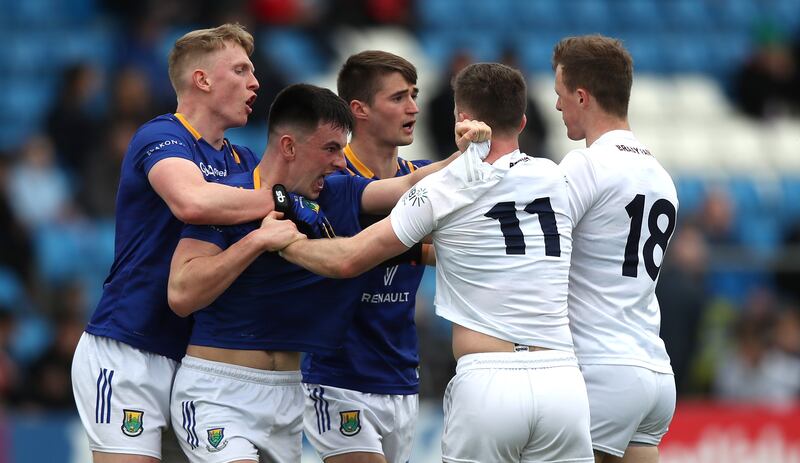 Tension rises between Wicklow's Cillian McDonald and Niall Kelly of Kildare. Photograph: Leah Scholes/Inpho