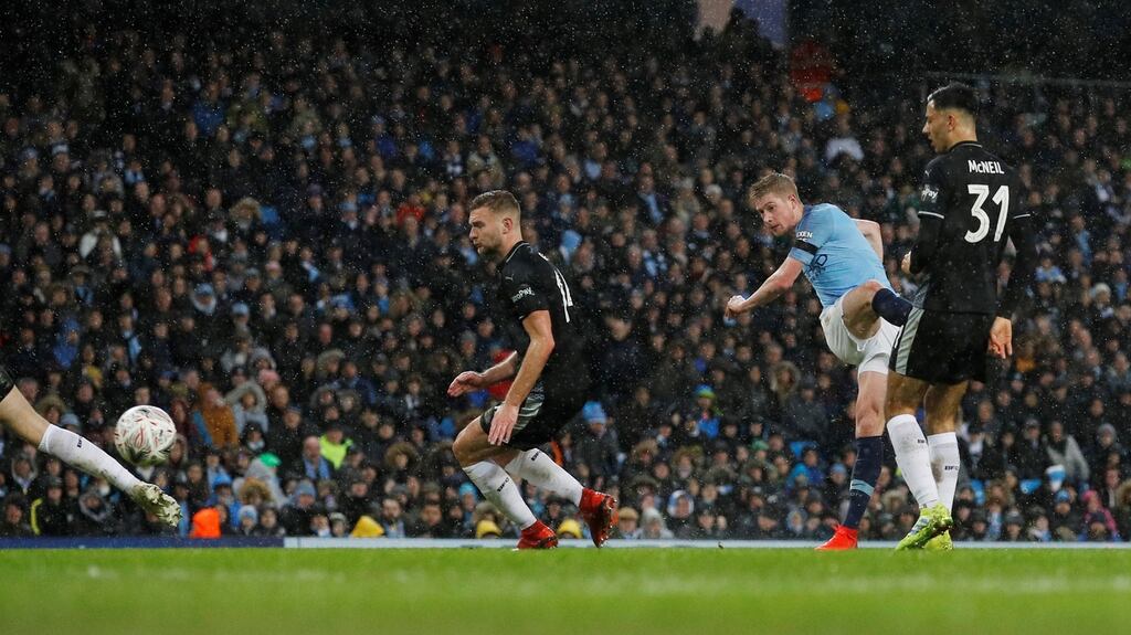 Manchester City’s Kevin De Bruyne scores their third goal during the FA Cup fourth-round game against Burnley at the Etihad stadium. Photograph: Phil Noble/Reuters