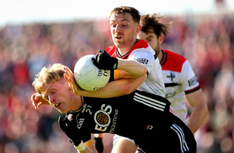Sam Mulroy and Adam Crimmins in a Louth v Down match in Newry in May. Photograph: Ryan Byrne/Inpho