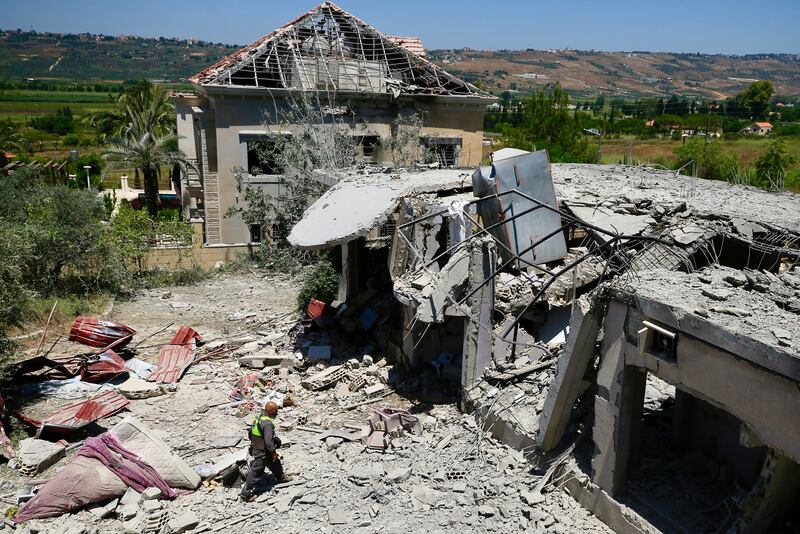 A Lebanese civil defence member inspects the site of an Israeli airstrike on the southern village of Khiam near the border with Israel. Photograph: AFP via Getty Images
