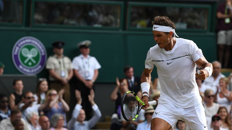 Rafael Nadal celebrates winning a point in a game in the final set against Karen Khachanov. Photo: Glyn Kirk/Getty Images