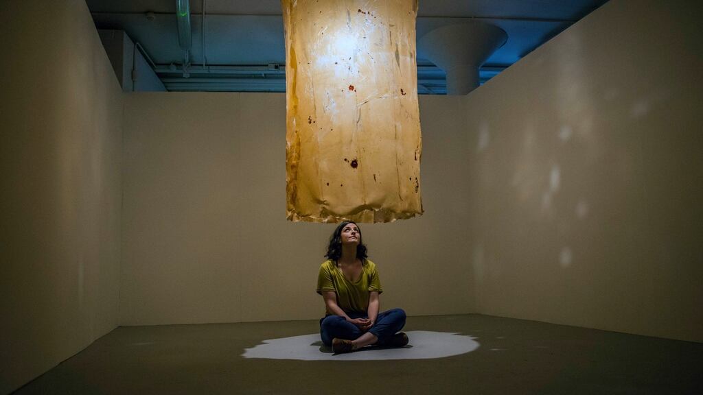 Visual artist Seibheal Mooney with her installation ‘In My Skin’ at the preview of the NCAD Graduate Show. Photograph: Brenda Fitzsimons/The Irish Times