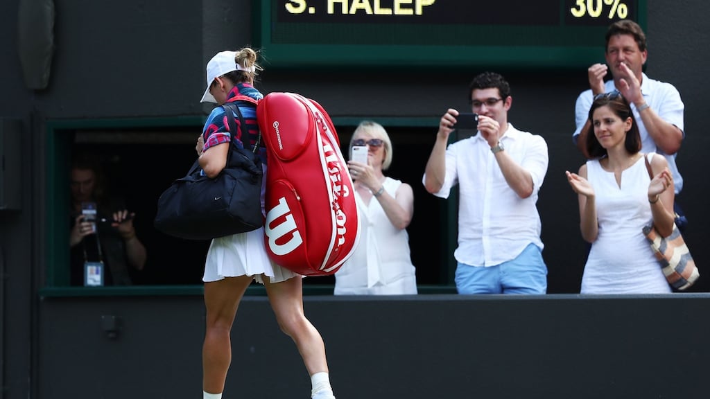 Simona Halep of Romania leaves the court after being defeated by Su-Wei Hsieh of Taiwan. Photograph: Michael Steele/Getty Images