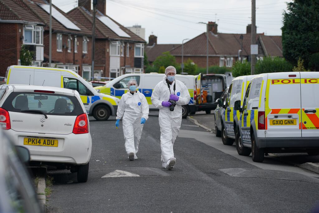 Forensic officers near the scene in Kingsheath Avenue, Knotty Ash, Liverpool, where nine-year-old Olivia Pratt-Korbel was been fatally shot. Photograph: Peter Byrne/PA Wire