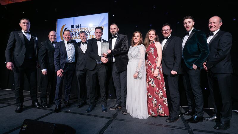 David Waldron, managing director, Tier3Tech, presents the Engineering Firm of the Year award to the Ethos Engineering team.