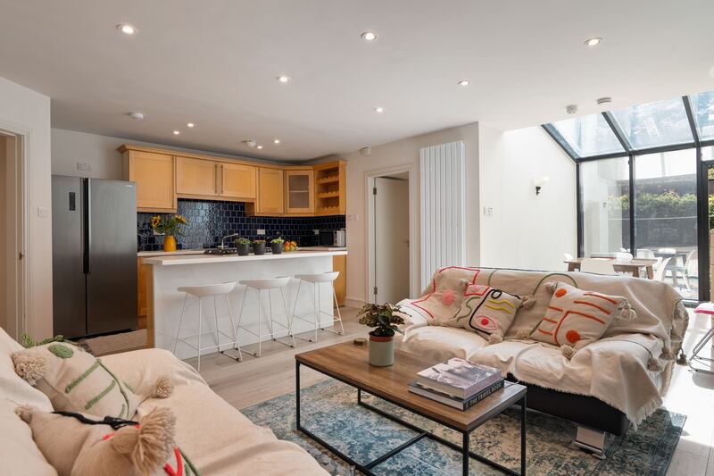 Open-plan living space in garden apartment