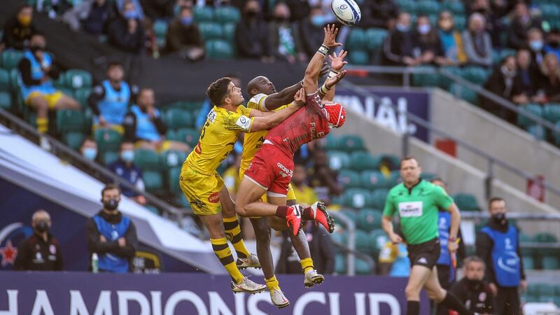 Brice Dulin and Raymond Rhule compete in the air with Cheslin Kolbe. Photo: James Crombie/Inpho