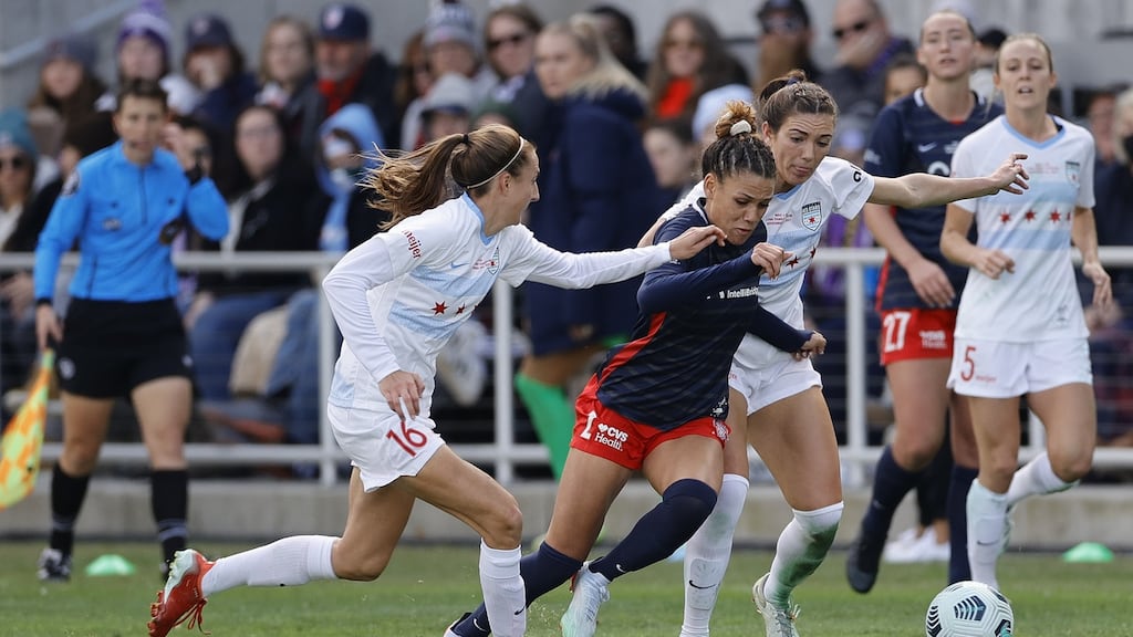 Trinity Rodman of Washington Spirit dribbling between Chicago Red Stars players during a NWSL Championship match in Louisville, Kentucky. Photograph: Tim Nwachukwu/Getty Images