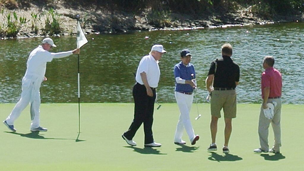 US president Donald Trump after playing golf with Japan’s   prime minister Shinzo Abe and Ernie Els. Photograph:   Jiji Press/AFP/Getty Images