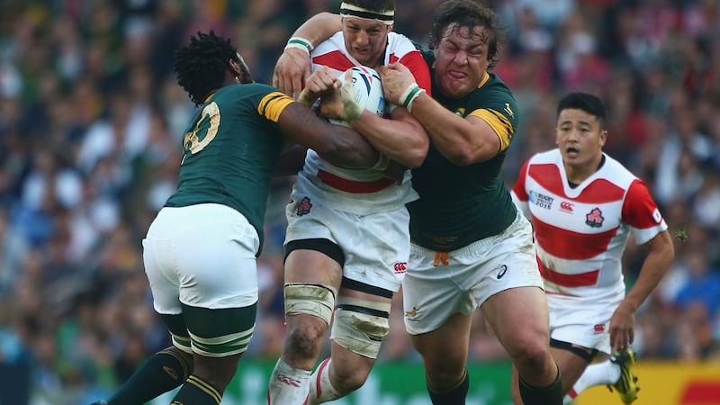 Luke Thompson of Japan drives through the South Africa defence during Japan’s famous victory over the Springboks at Brighton during the 2015 World Cup. Photograph: Charlie Crowhurst/Getty